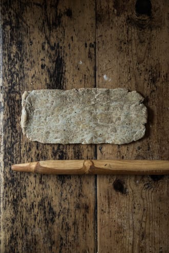 Rolling out the sourdough pastry